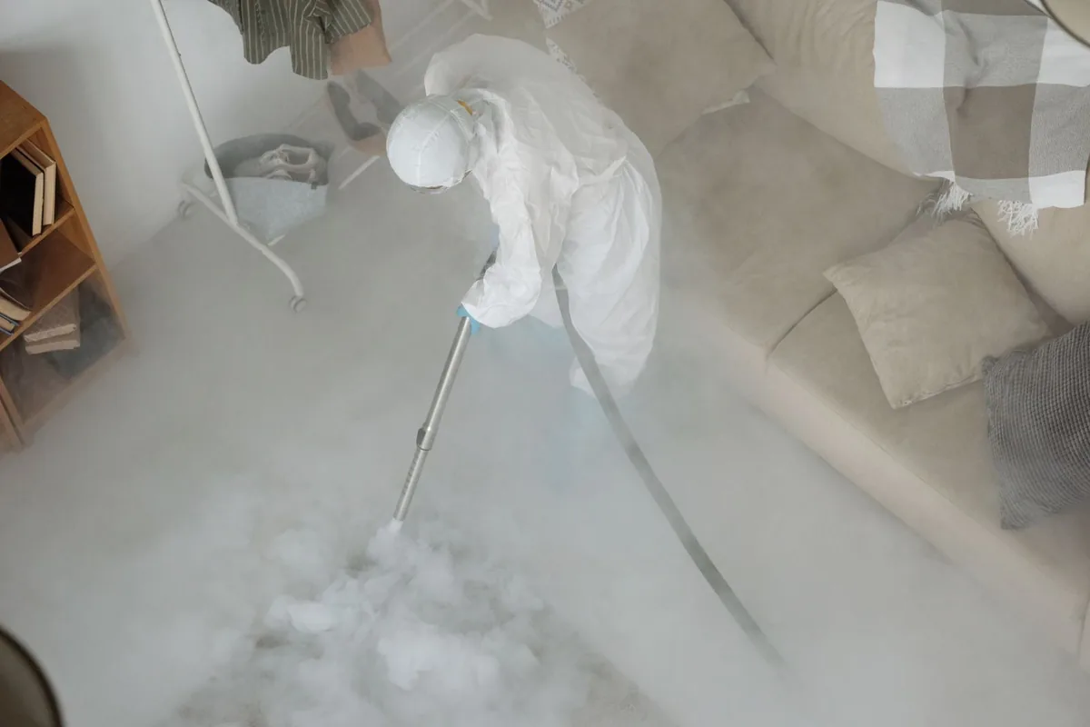 Biohazard cleanup technician in protective equipment, Olympia Heights, FL